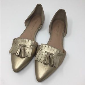 Gold flats with tassels.